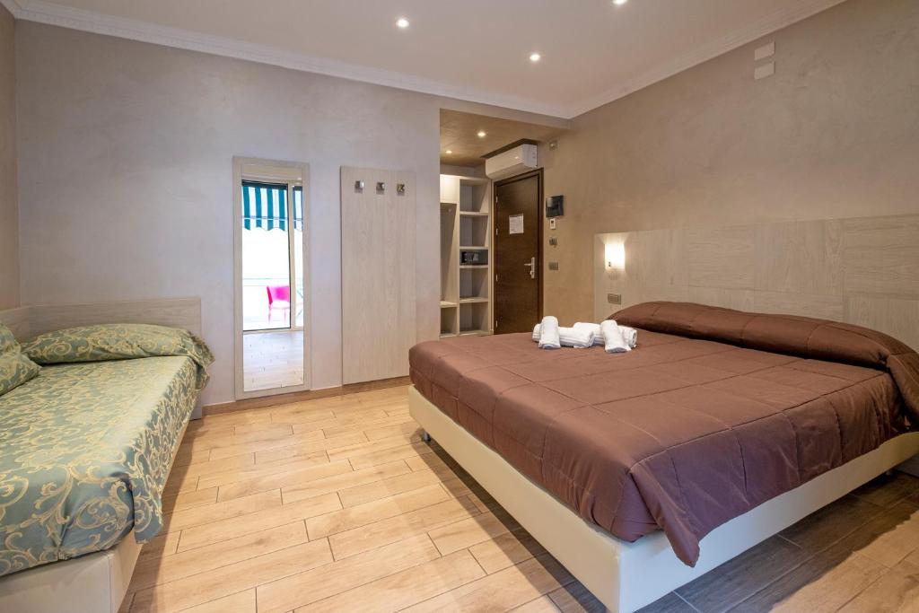 A bed or beds in a room at Nanà