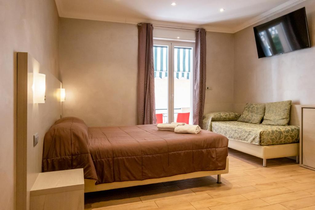 A bed or beds in a room at Nanà