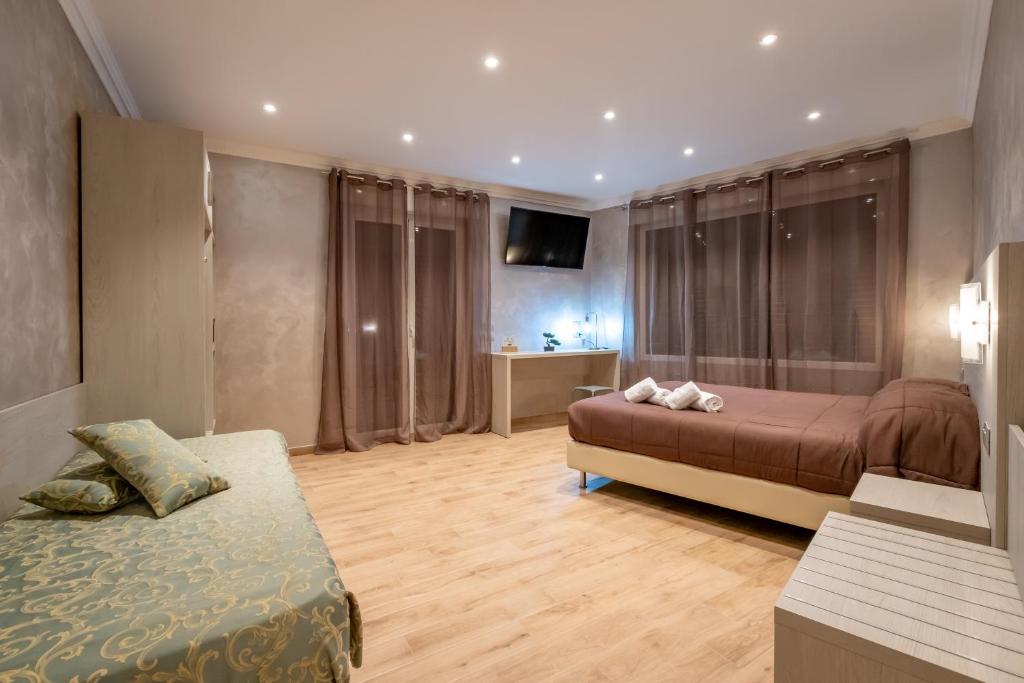 A bed or beds in a room at Nanà