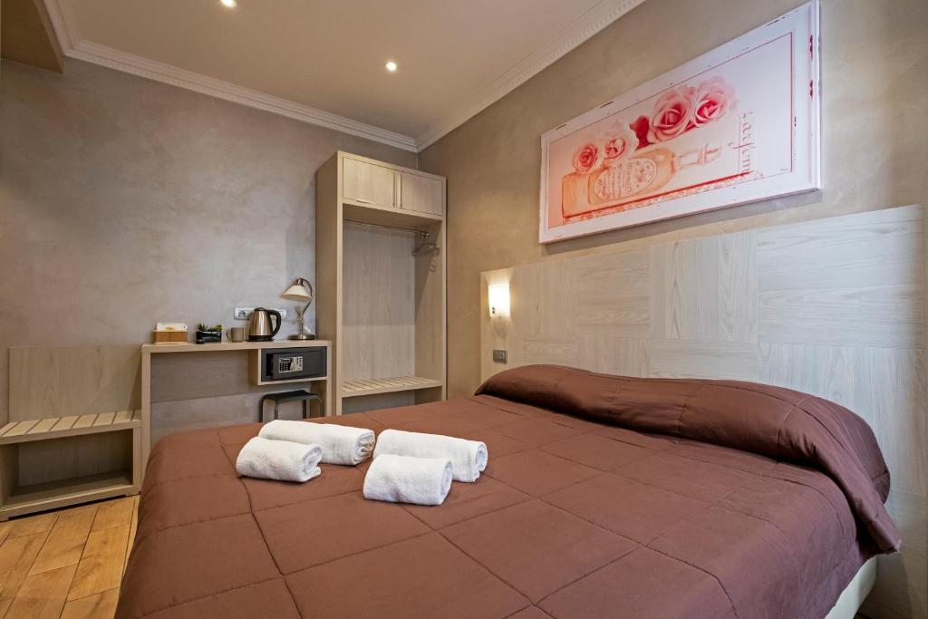A bed or beds in a room at Nanà