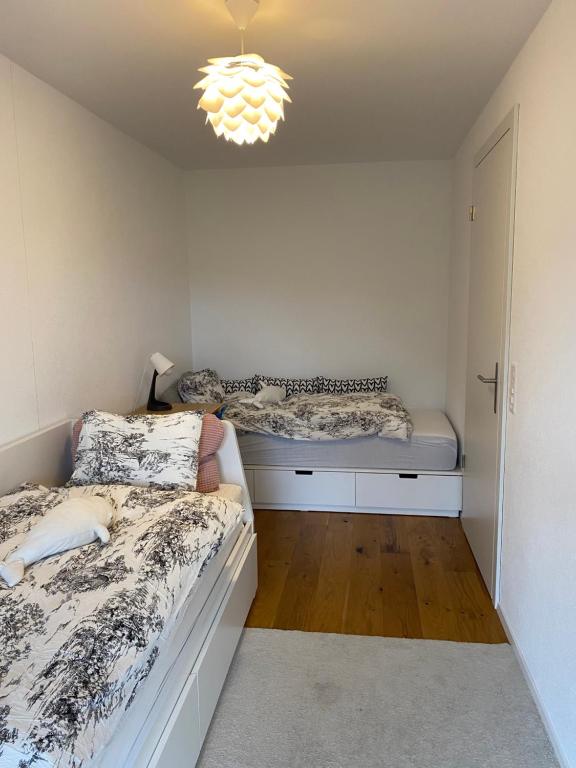 Postel nebo postele na pokoji v ubytování Residenz Panorama - Blatten bei Naters VS