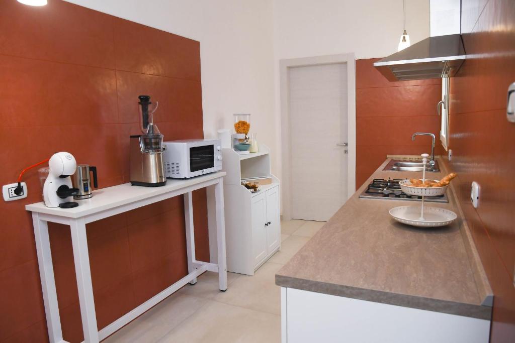 Kuchyň nebo kuchyňský kout v ubytování B&B Benefici