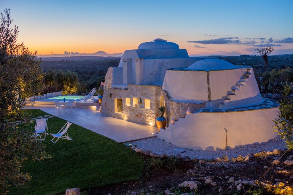 an aerial view of a house with a dome at Tenuta Trullo Padronale-Private Pool Exclusive Villa Ostuni in Ostuni