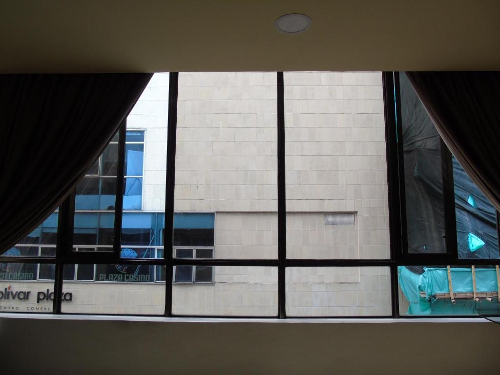 a view of a building from a window at Hotel Paradise del Cafe in Pereira