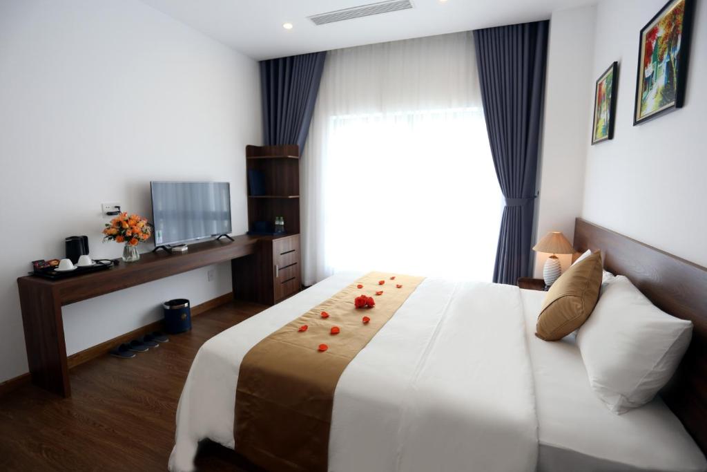 Giường trong phòng chung tại Silk River Hotel Ha Giang