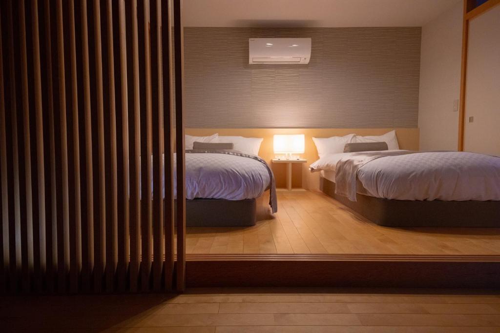 Postel nebo postele na pokoji v ubytování Toba Grand Hotel