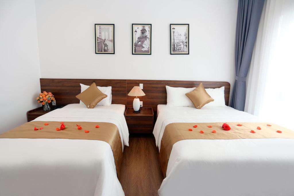 Giường trong phòng chung tại Silk River Hotel Ha Giang