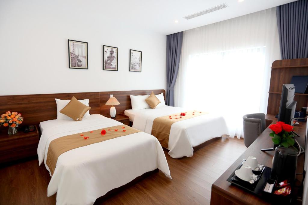 Giường trong phòng chung tại Silk River Hotel Ha Giang