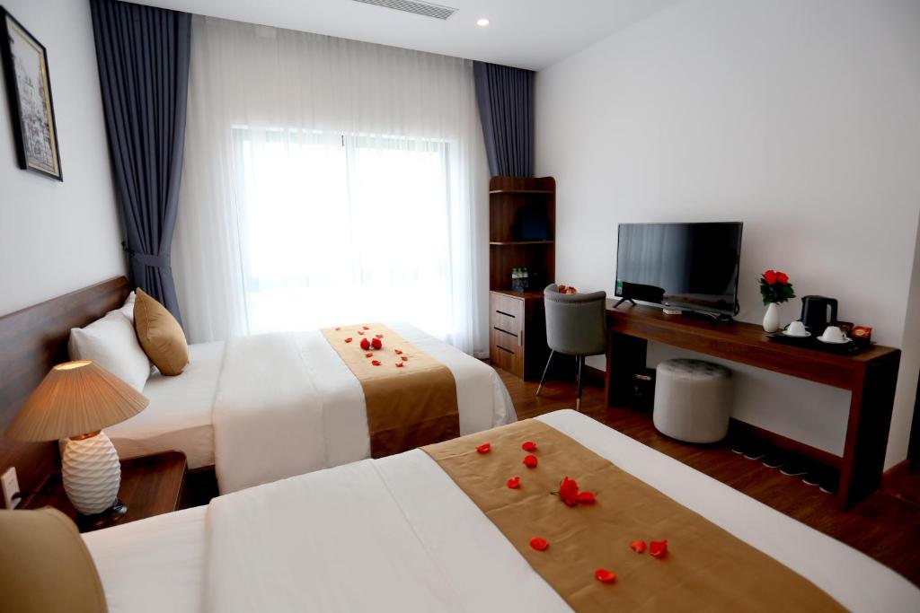 Giường trong phòng chung tại Silk River Hotel Ha Giang