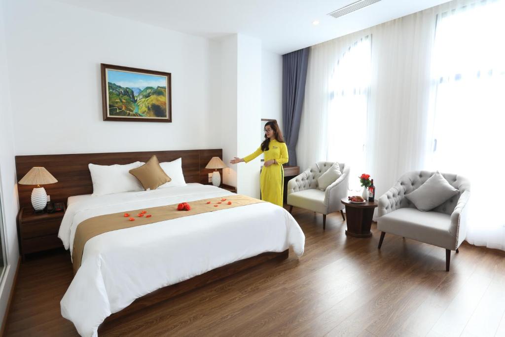 Giường trong phòng chung tại Silk River Hotel Ha Giang