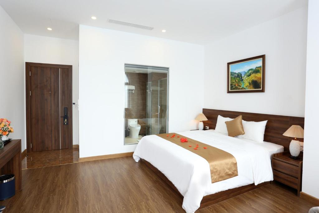 Giường trong phòng chung tại Silk River Hotel Ha Giang