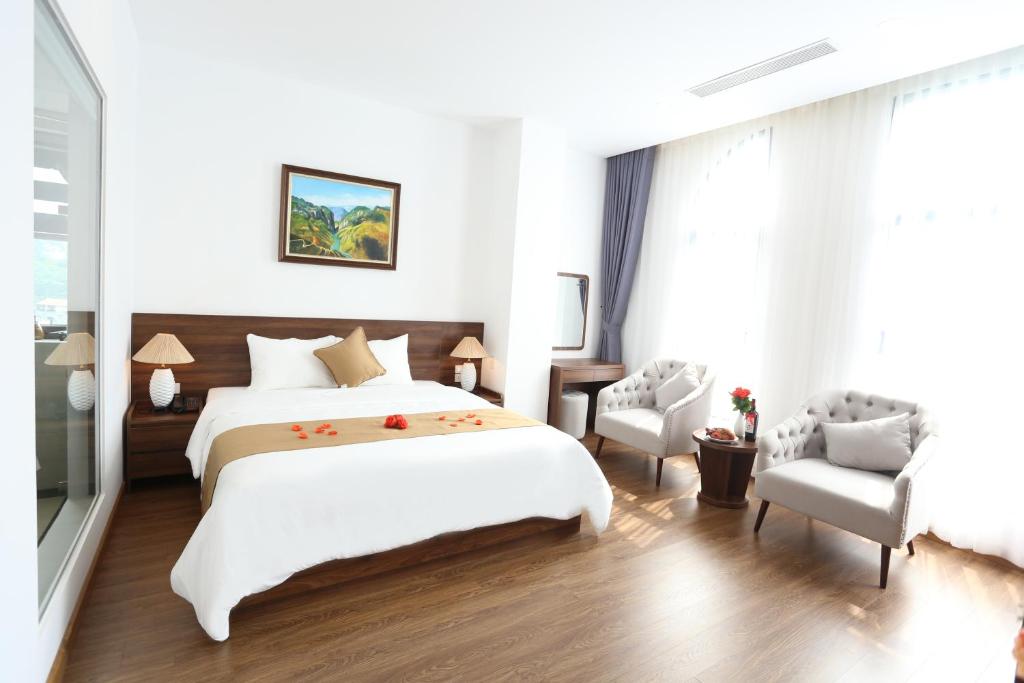 Giường trong phòng chung tại Silk River Hotel Ha Giang