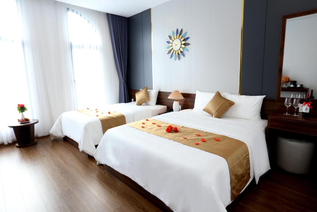 Giường trong phòng chung tại Silk River Hotel Ha Giang