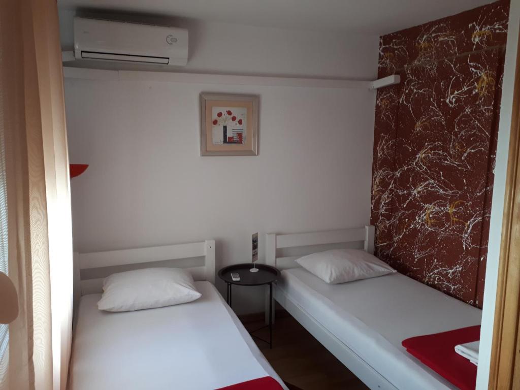 Postel nebo postele na pokoji v ubytování Hostel Miran Mostar