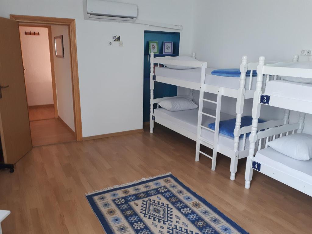 Postel nebo postele na pokoji v ubytování Hostel Miran Mostar