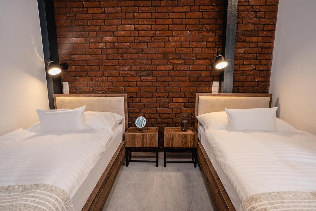 Postel nebo postele na pokoji v ubytování Garni Hotel DOCK Bratislava