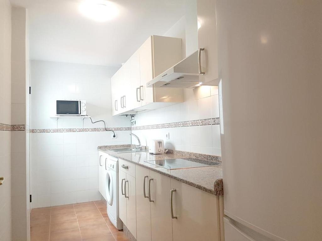 Kuchyňa alebo kuchynka v ubytovaní Central Apartment in Sanlucar