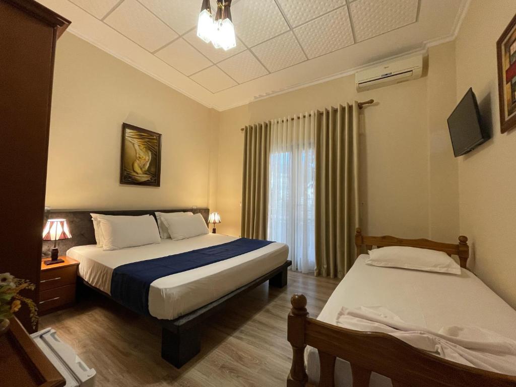 Postel nebo postele na pokoji v ubytování Hotel Benilva