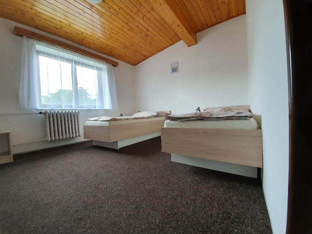 Postel nebo postele na pokoji v ubytování Penzion Hilšer