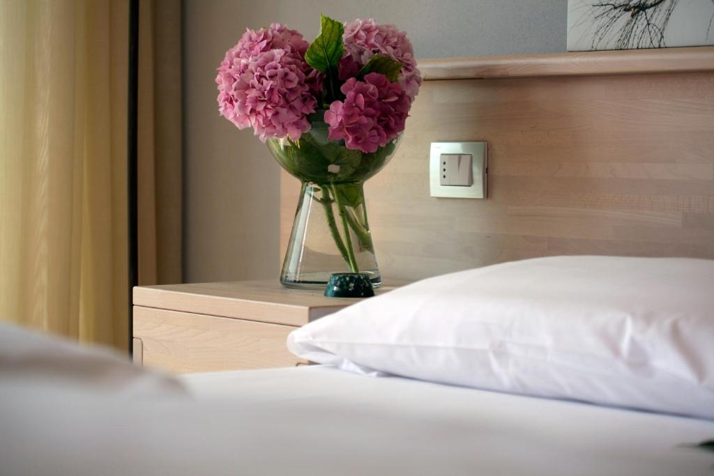 Postel nebo postele na pokoji v ubytování Eco Hotel Ariston