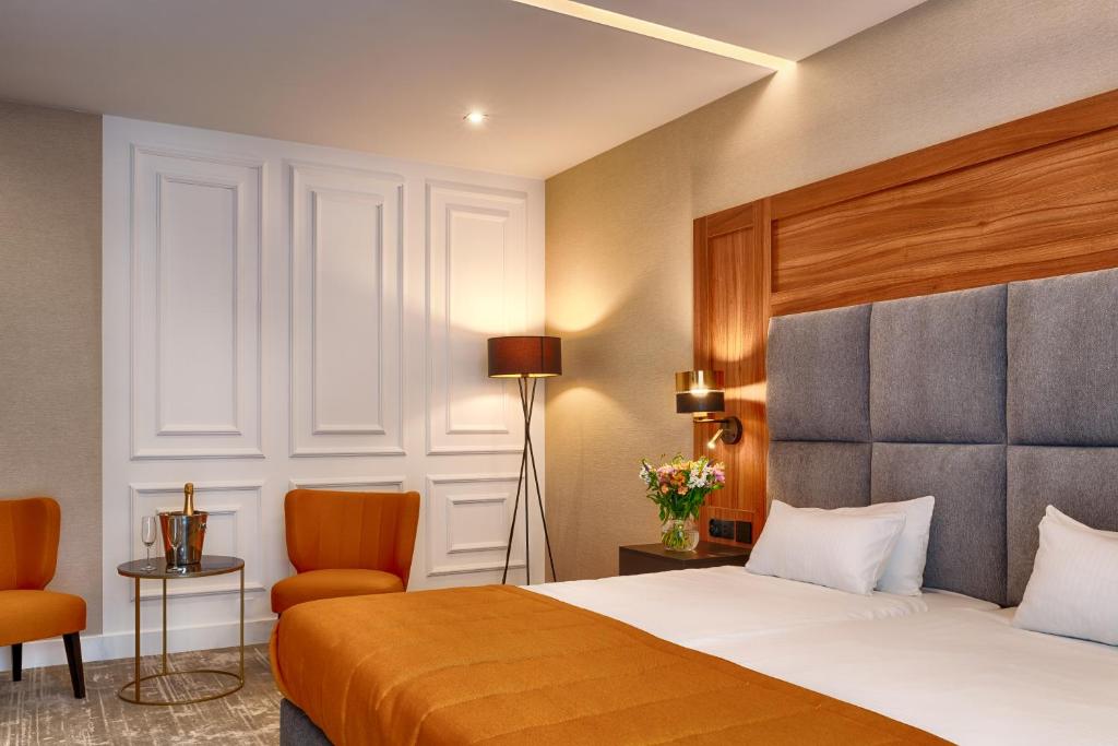 Posteľ alebo postele v izbe v ubytovaní Grand Focus Hotel Szczecin