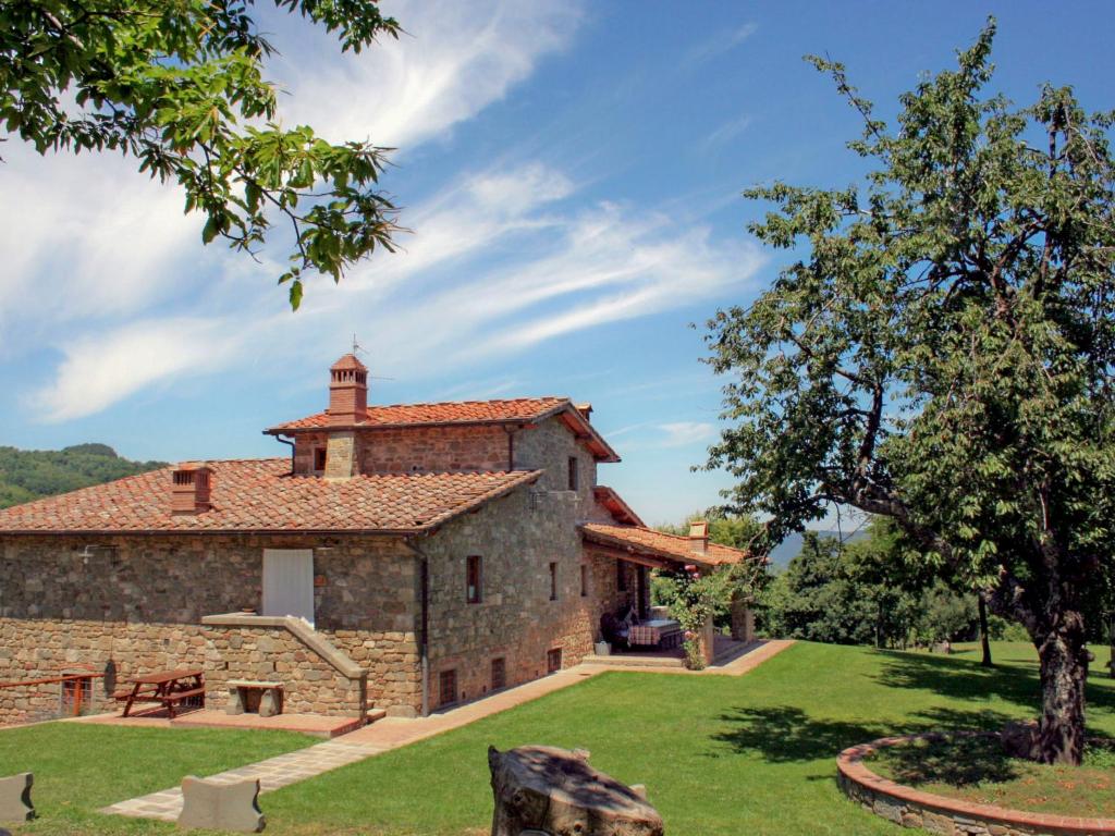 an external view of the farmhouse with a garden at Holiday Home Lucolena by Interhome in Lucolena in Chianti