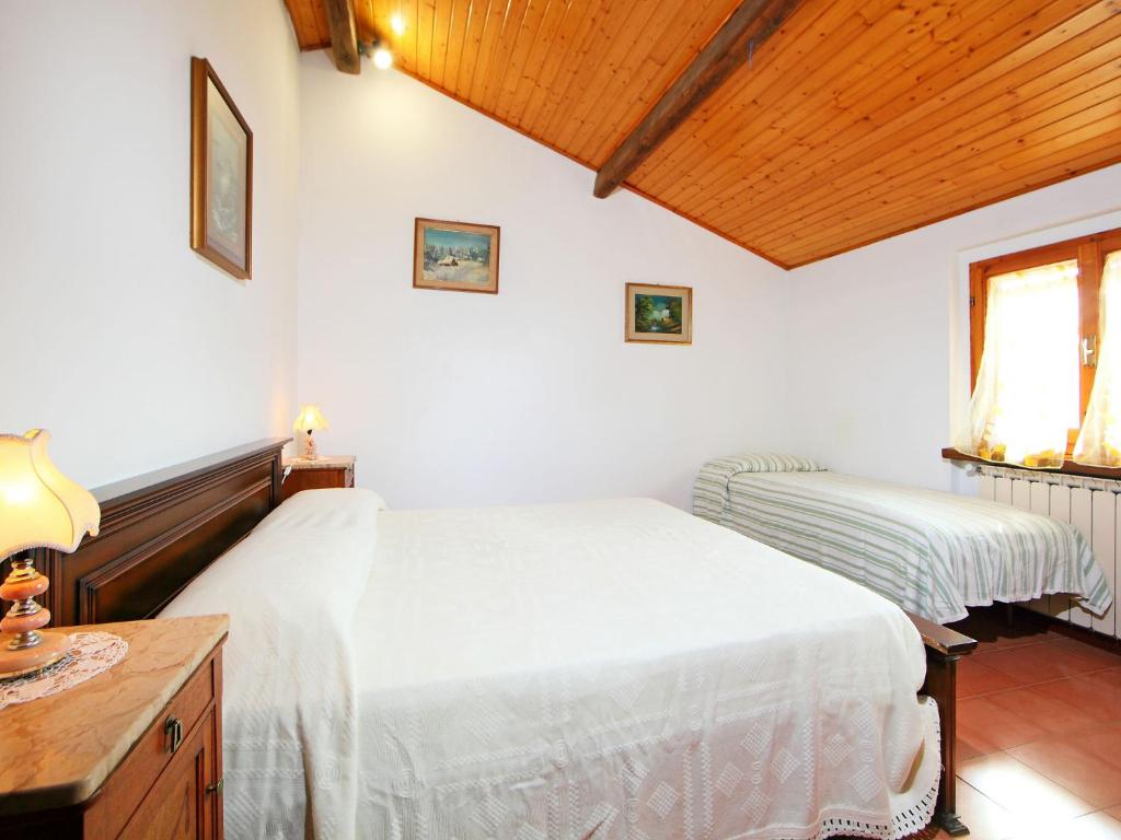 Posteľ alebo postele v izbe v ubytovaní Holiday Home Posticcia Vecchia by Interhome