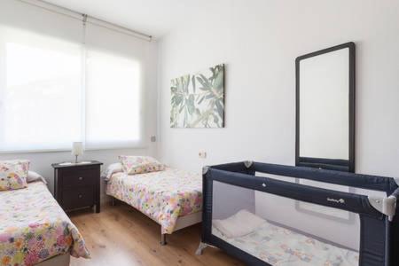A bed or beds in a room at Piso Zona Plaza España, junto a Montjuic,