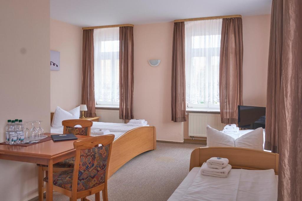Postel nebo postele na pokoji v ubytování Boselblick Gästezimmer & Biergarten