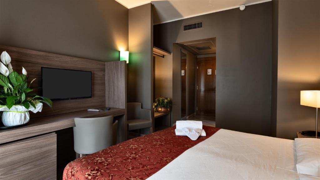 Postel nebo postele na pokoji v ubytování Hotel Sunflower