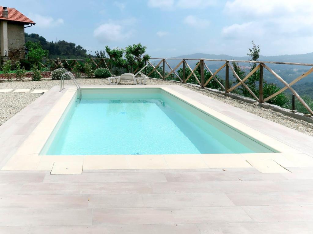 a swimming pool with a view of the water at Holiday Home Casa U Baregu by Interhome in Diano San Pietro