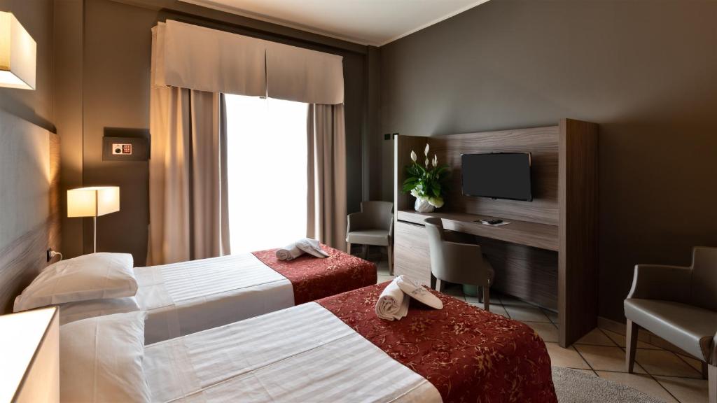 Postel nebo postele na pokoji v ubytování Hotel Sunflower