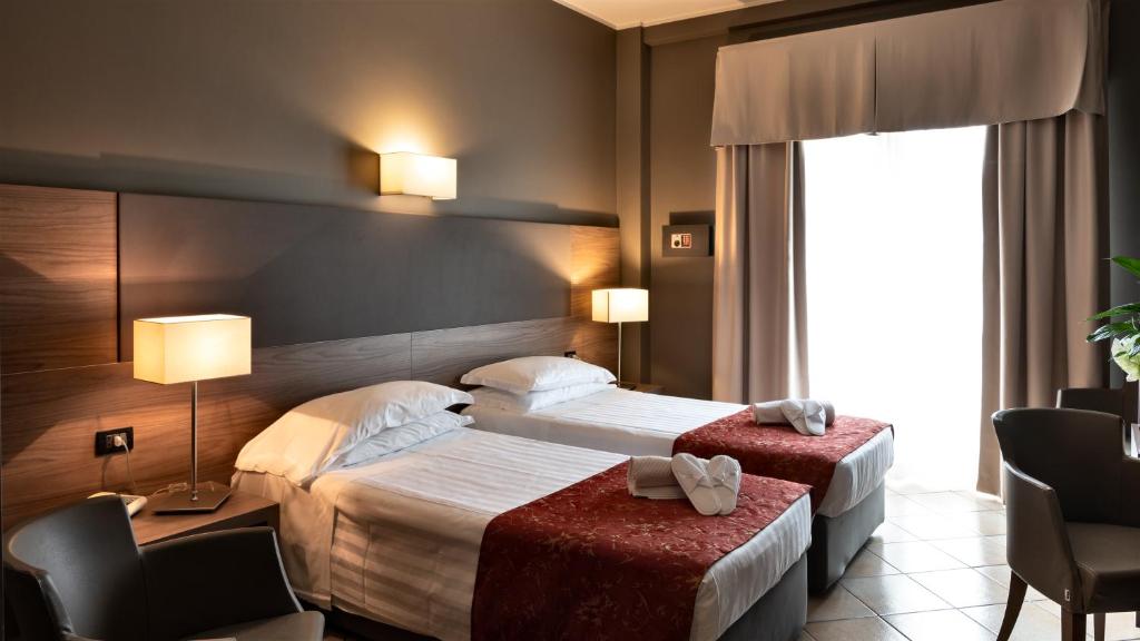 Postel nebo postele na pokoji v ubytování Hotel Sunflower