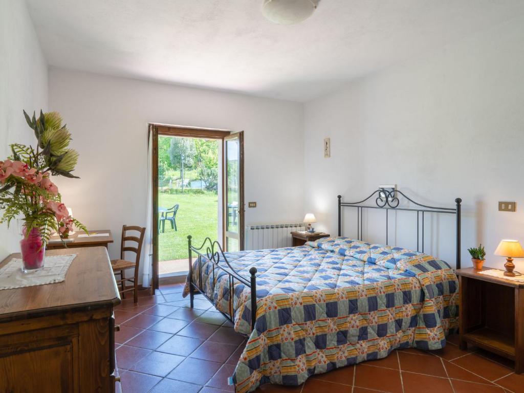 Postel nebo postele na pokoji v ubytování Holiday Home Podere Ritali by Interhome