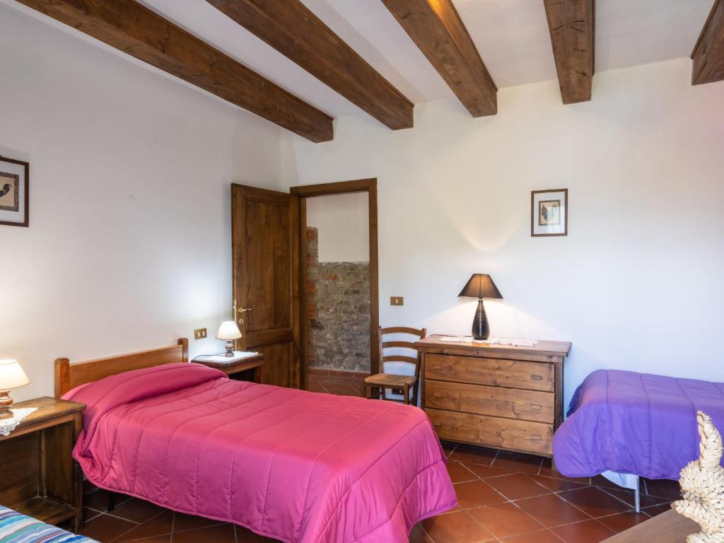 Postel nebo postele na pokoji v ubytování Holiday Home Podere Ritali by Interhome