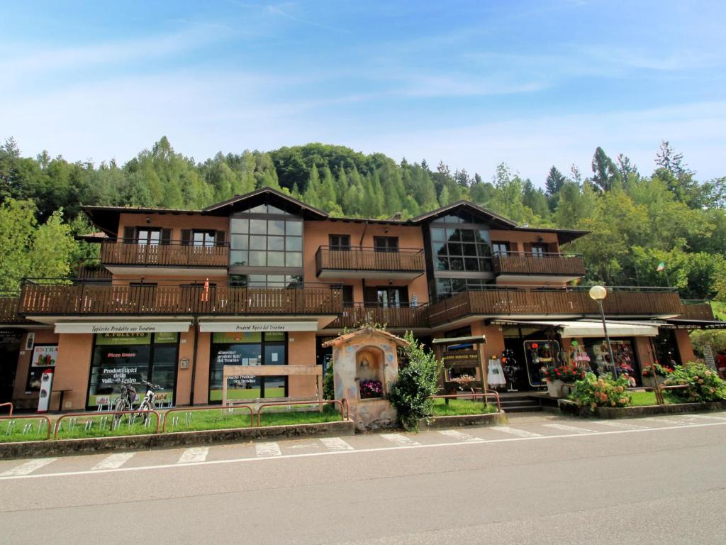 a large building on the side of a road at Apartment Superior-1 by Interhome in Mezzolago