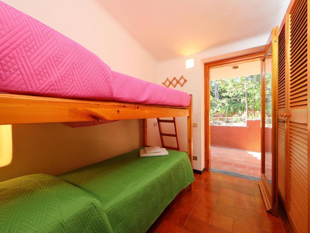 A bed or beds in a room at Holiday Home Terre Rare by Interhome