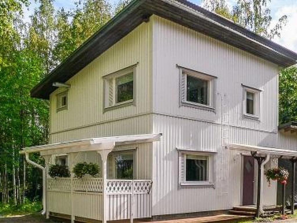 a small house with a white at Holiday Home Halmesaari by Interhome in Kerkonjoensuu