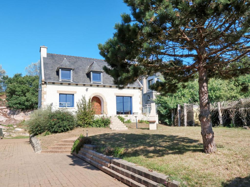 a house with a tree in front of it at Holiday Home Etoile de Mer by Interhome in Erquy