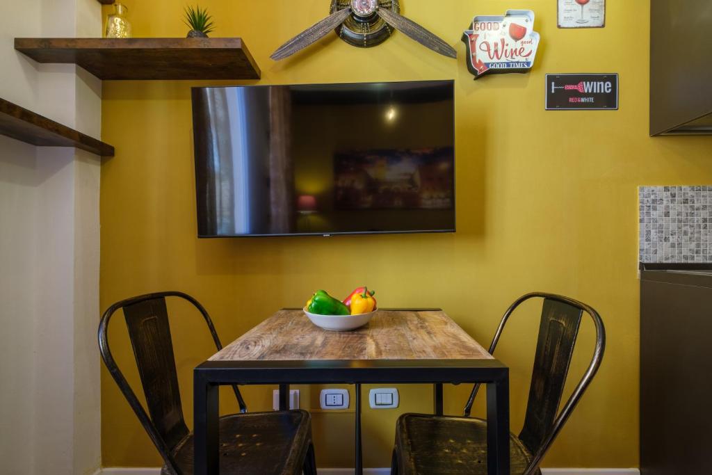 Televízia a/alebo spoločenská miestnosť v ubytovaní Casa del Sole by Studio Vita