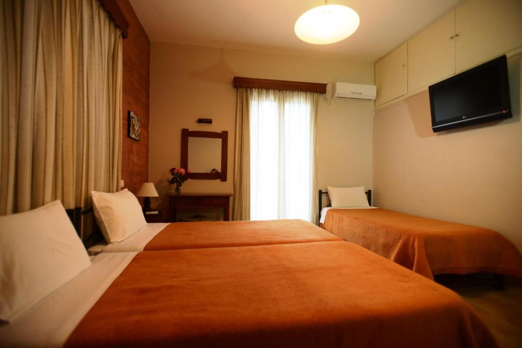 Postel nebo postele na pokoji v ubytování Argo Hotel