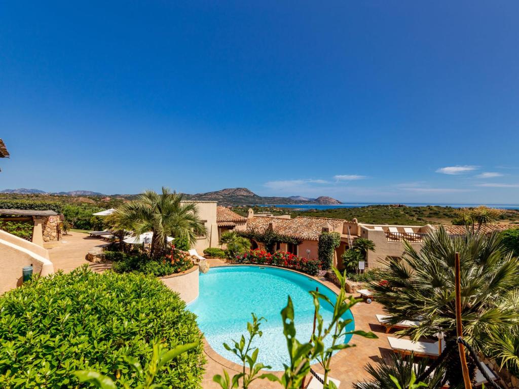 The swimming pool at or close to Holiday Home Dalia 20 - Vista Village by Interhome