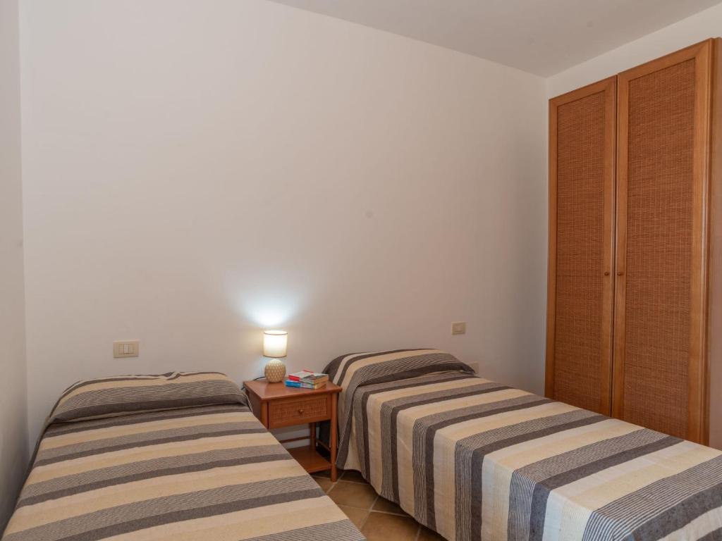 A bed or beds in a room at Holiday Home Dalia 20 - Vista Village by Interhome
