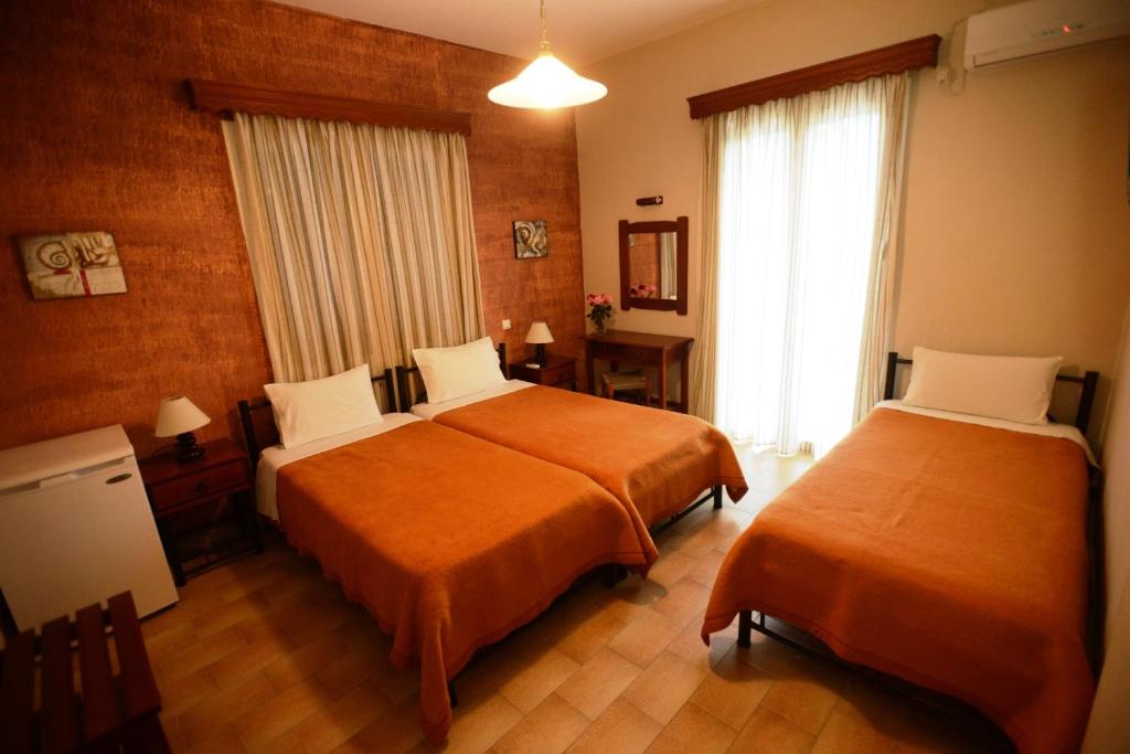 Postel nebo postele na pokoji v ubytování Argo Hotel