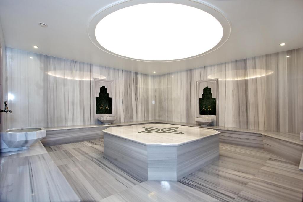 a large bathroom with a large circular ceiling at Grand Hotel Gulsoy Old City in Istanbul