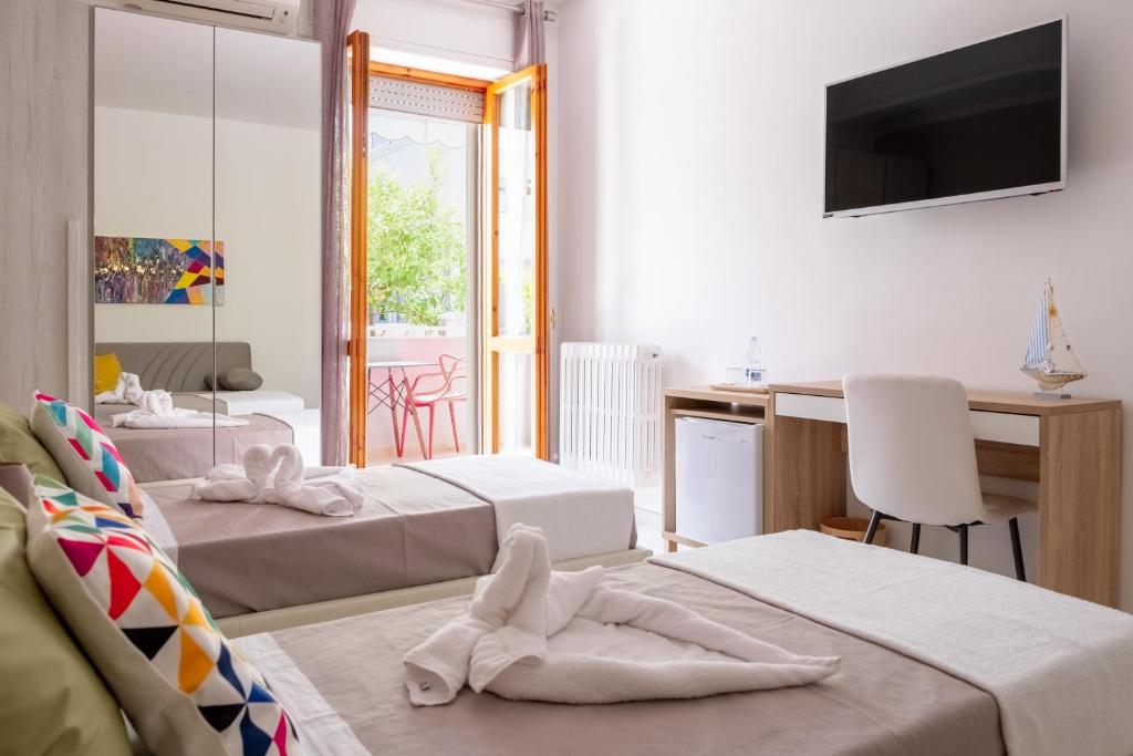 Uma cama ou camas num quarto em Vele d'Otranto B&B