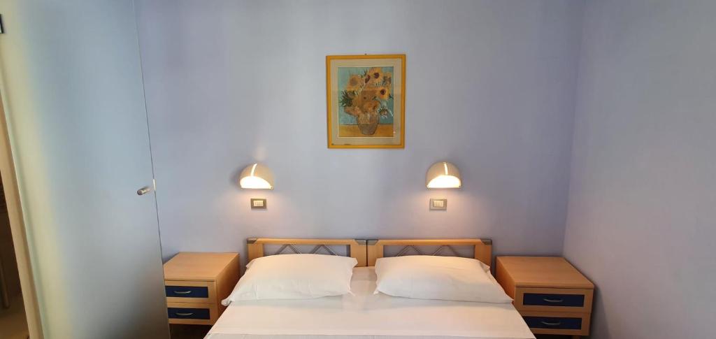 Postel nebo postele na pokoji v ubytování Hotel Sud Est by Fam Rossetti