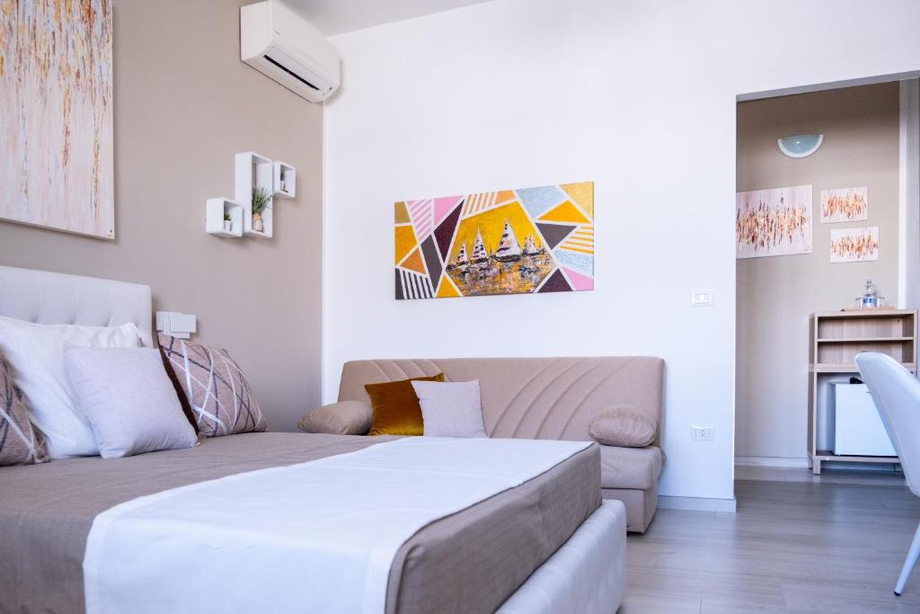Uma cama ou camas num quarto em Vele d'Otranto B&B