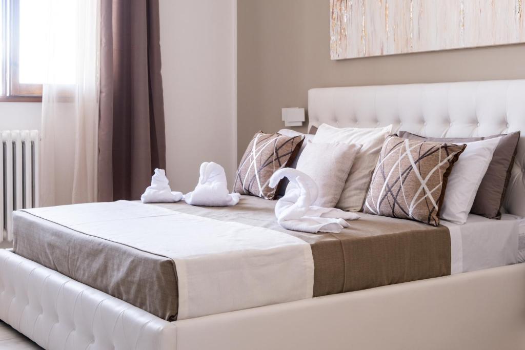 Uma cama ou camas num quarto em Vele d'Otranto B&B