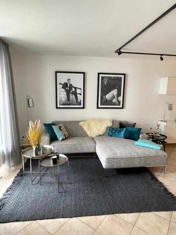 a living room with a couch and a rug at Ferienwohnung Alte Burg Koblenz in Koblenz